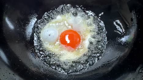 Frying-egg-in-hot-boiling-oil