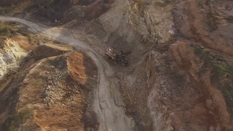 Flight-Towards-A-Giant-Walking-Excavator-Stands-In-An-Excavated-Quarry