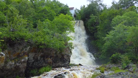 Aerial-Closeup-Approach-on-Beautiful-Gushing-Waterfall-in-Beaumont,-Quebec