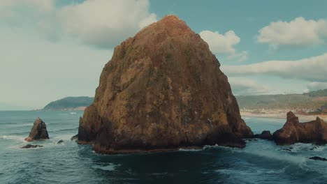 4k-Aerial-big-rock-in-the-ocean-on-West-coast-drone-truck-right-+-jib-up
