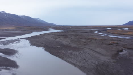 Aerial-shot-of-an-alluvial-fan-in-an-arctic-valley-7