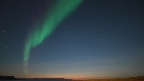 The-beautiful-show-of-the-northern-lights-in-the-night-sky-above-the-desolate-landscape