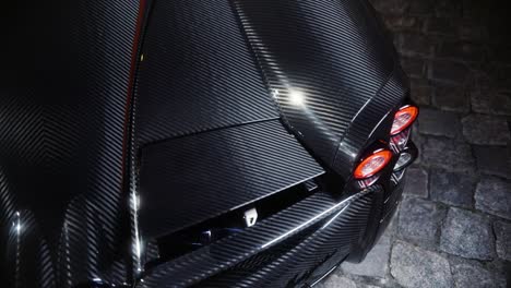 Italian-full-carbon-sport-car-rear-detail-in-the-dark