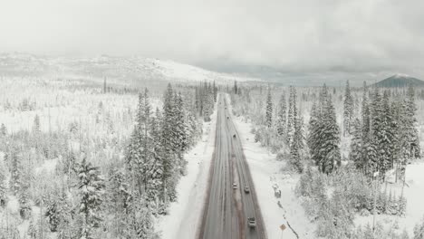 4k-Aerial-country-road-in-snowy-mountains-Drone-jib-down-shot