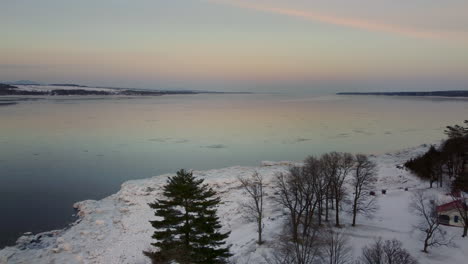 Aerial---Flying-towards-the-St-Lawrence-river-at-sunset