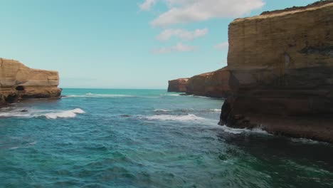 4k-Aerial-coast-cliff-on-blue-ocean-with-big-rock-in-the-water