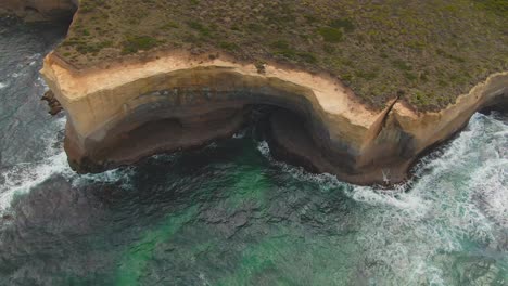 4k-Aerial-high-cliff-on-turquoise-water-Drone-overhead-shot