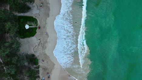 A-top-down-shot-of-two-sides-one-land-and-the-other-is-ocean-water