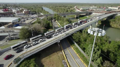 AERIAL---International-Bridge-over-Rio-Grande,-United-States-Mexico-border,-wide-shot-1