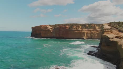 4k-Aerial-coast-cliff-on-turquoise-ocean-Drone-dolly-in-shot-part-2