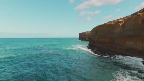 4k-Aerial-coast-cliff-on-turquoise-ocean-Drone-dolly-in-shot-part-1