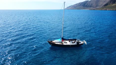 A-boat-sailing-near-the-open-waters-of-Kailua-Beach-Park,-Hawaii,-USA-4K-UHD