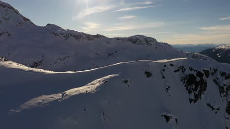 A-sunny-mountain-ridge-in-the-winter-near-Chief-Pascall-in-Pemberton,-British-Columbia