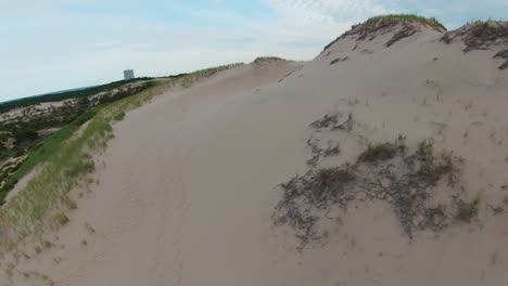 FPV-drone-shot-of-soft-white-sand-and-sand-dunes-in-the-Dune-Shacks-Trail-in-Provincetown,-Cape-Cod,-Massachusetts