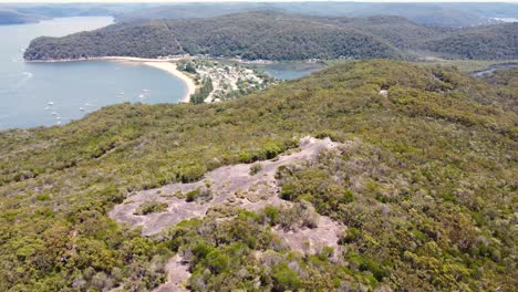 Aerial-drone-pan-shot-of-Elephant-Rock-formation-Patonga-Beach-Bay-National-Park-Bushland-tourism-Central-Coast-NSW-Australia-4K