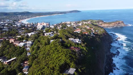 Aerial-drone-landscape-shot-of-North-Avoca-cliffside-coastline-beaches-of-Terrigal-suburbs-Central-Coast-tourism-NSW-Australia-4K