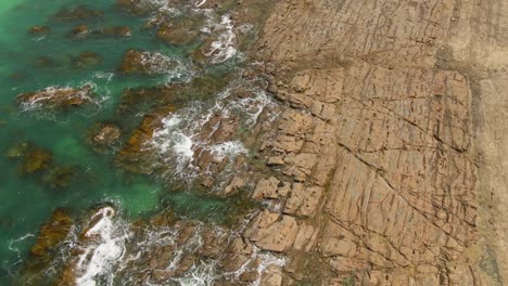 4K-Aerial-rocky-beach-of-south-Australia-with-turquoise-water---Drone-overhead-shot