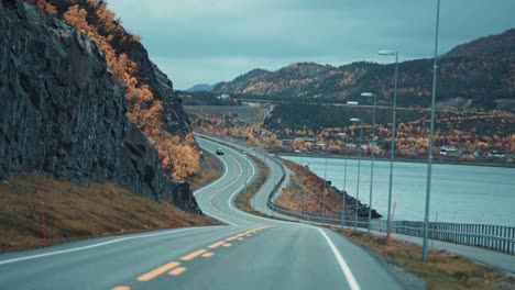 Two-lane-road-following-the-Alta-fjord-coastline