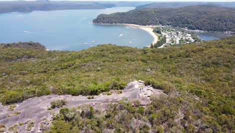 Aerial-drone-shot-of-Elephant-Rock-tourism-rock-formation-Brisbane-Water-National-Park-bushland-Central-Coast-NSW-Australia-4K
