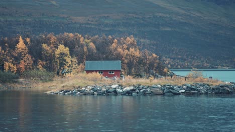 A-small-red-fishing-hut-on-the-shore-of-the-fjord
