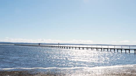 Slow-motion-landscape-scenic-shot-of-Long-Jetty-boardwalk-wharf-wood-bridge-lake-reflection-morning-nature-Central-Coast-tourism-NSW-Australia-HD