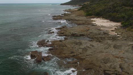 4K-Aerial-rocky-beach-of-south-Australia---Drone-overhead-+-dolly-in-shot