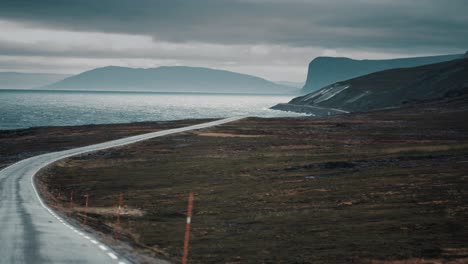 The-narrow-coastal-road-winding-along-the-fjord