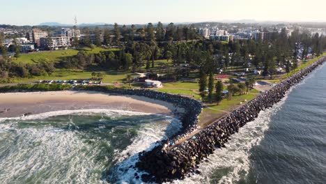 Drone-aerial-scenic-view-of-rural-Port-Macquarie-town-beach-break-wall-with-skatepark-travel-tourism-Hastings-river-Mid-north-Coast-NSW-Australia-4K