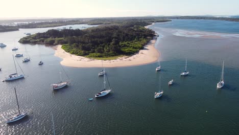Aerial-drone-shot-of-nature-sand-flat-banks-island-in-Hastings-River-inlet-with-yachts-and-sail-boats-Pacific-Ocean-Port-Macquarie-NSW-Mid-North-Coast-Australia-4K