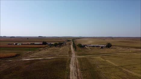 Drone-flying-backwards-in-the-hungarian-lowland,-in-the-big-plain,-the-"Puszta