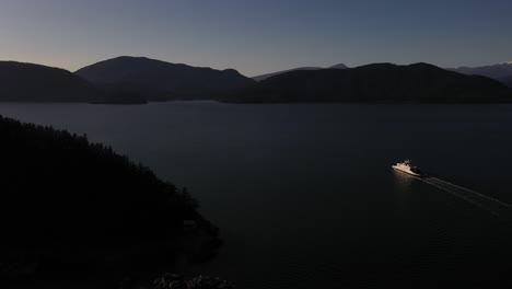 Stunning-aerial-view-of-a-ferry-sailing-at-sunset-on-the-Howe-Sound