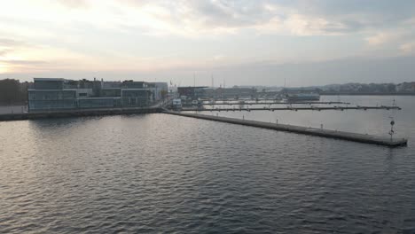 Approaching-the-harbour-with-boats-lying-next-to-the-docks-in-the-beautiful-naval-city-of-Karlskrona,-Sweden