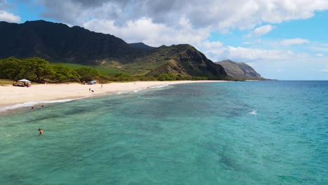 People-swim-in-the-Pacific-Ocean-and-the-shore-at-Kailua-Beach-Park-in-Oahu-Hawaii-USA-4K-UHD