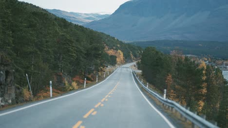 Narrow-two-lane-road-snaking-along-the-fjord-2