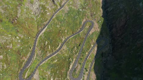 An-aerial-view-of-the-narrow-road-snaking-down-the-mountain