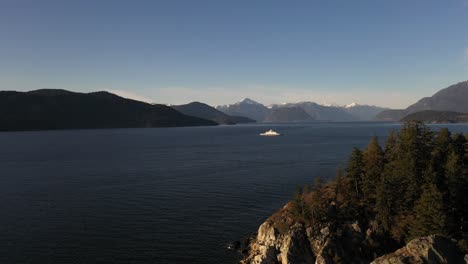 Cinematic-shot-of-a-ferry-sailing-during-sunset-on-the-Howe-Sound