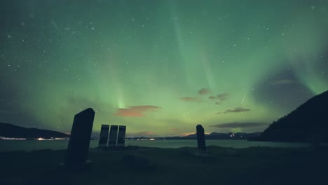 Northern-lights-above-the-Battle-for-Narvik-memorial-on-the-shore-of-the-fjord