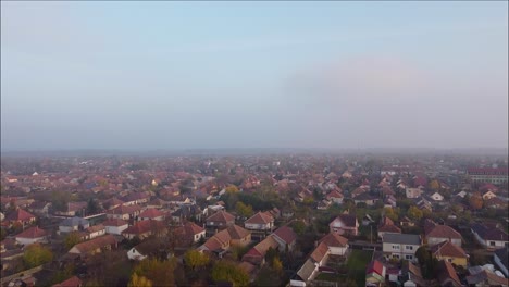 Drone-flying-over-foggy-town