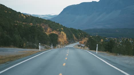 Narrow-two-lane-road-snaking-along-the-fjord-1