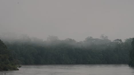 Amazon-Rainforest-And-River-Shrouded-By-Thick-Fog-In-Ecuador