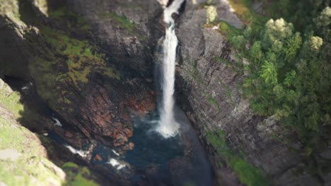 Aerial-view-of-the-massive-waterfall-falling-into-a-deep-gorge