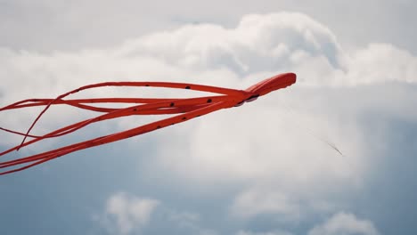 A-close-up-shot-of-the-red-octopus-kite-floating-in-the-air-at-the-Romo-kite-festival
