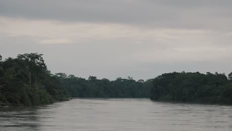 Amazon-Rainforest-And-Lagoon-Against-Cloudy-Sky-In-Ecuador---wide