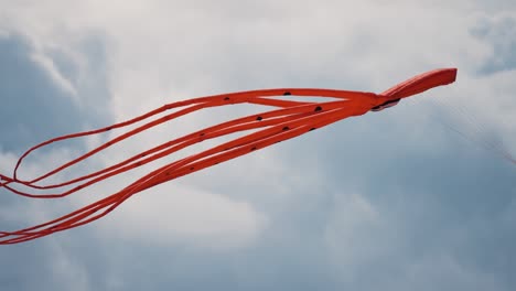 A-close-up-shot-of-the-red-octopus-kite-floating-in-the-air-at-the-Romo-kite-festival-1