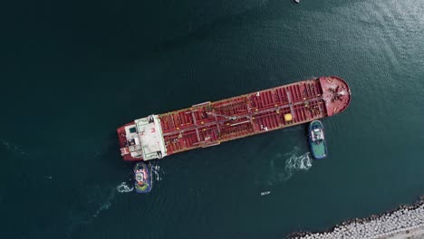 Aerial-view-above-an-empty-tanker-arriving-at