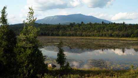 Mount-Katahdin-framed-beautifully-by-Maine's-forest-landscape