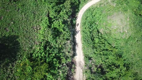 Drone-view-of-coffee-bags-transportation-on-dirt