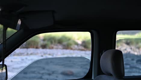 Rural-landscape-seen-through-car-window-with-foreground