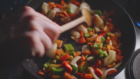 Stir-frying-Sweet-Onions-And-Bell-Peppers-In-Pan
