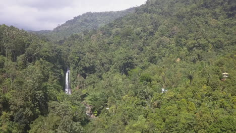 Aerial-flight-to-tall-jungle-mountain-waterfall-North